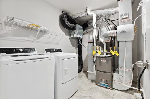 Laundry room with ventilated shelving for your convenience