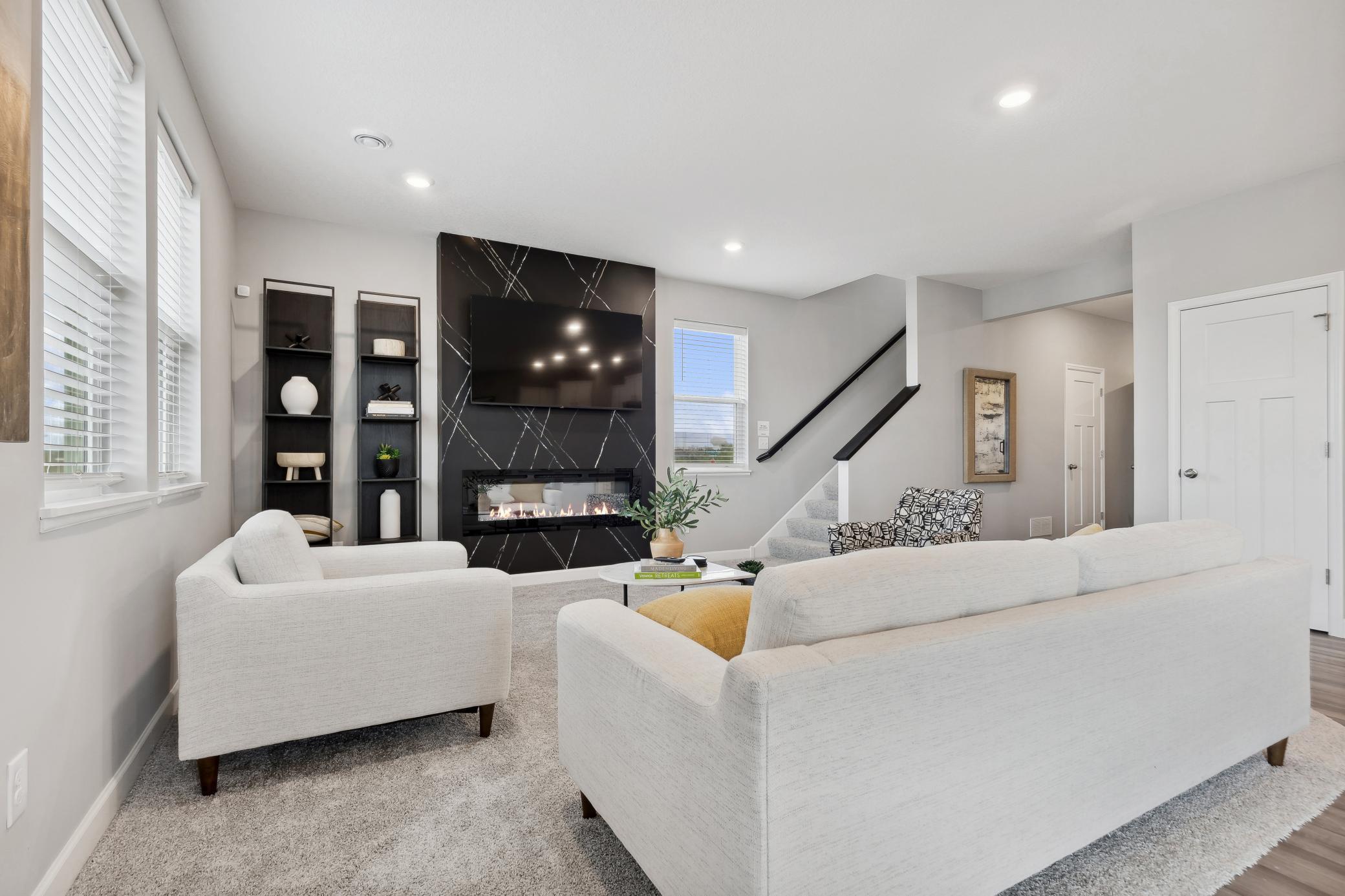 A comfortable Great Room is ideal for unwinding at the end of the day and shares an open layout with the dining area and kitchen.