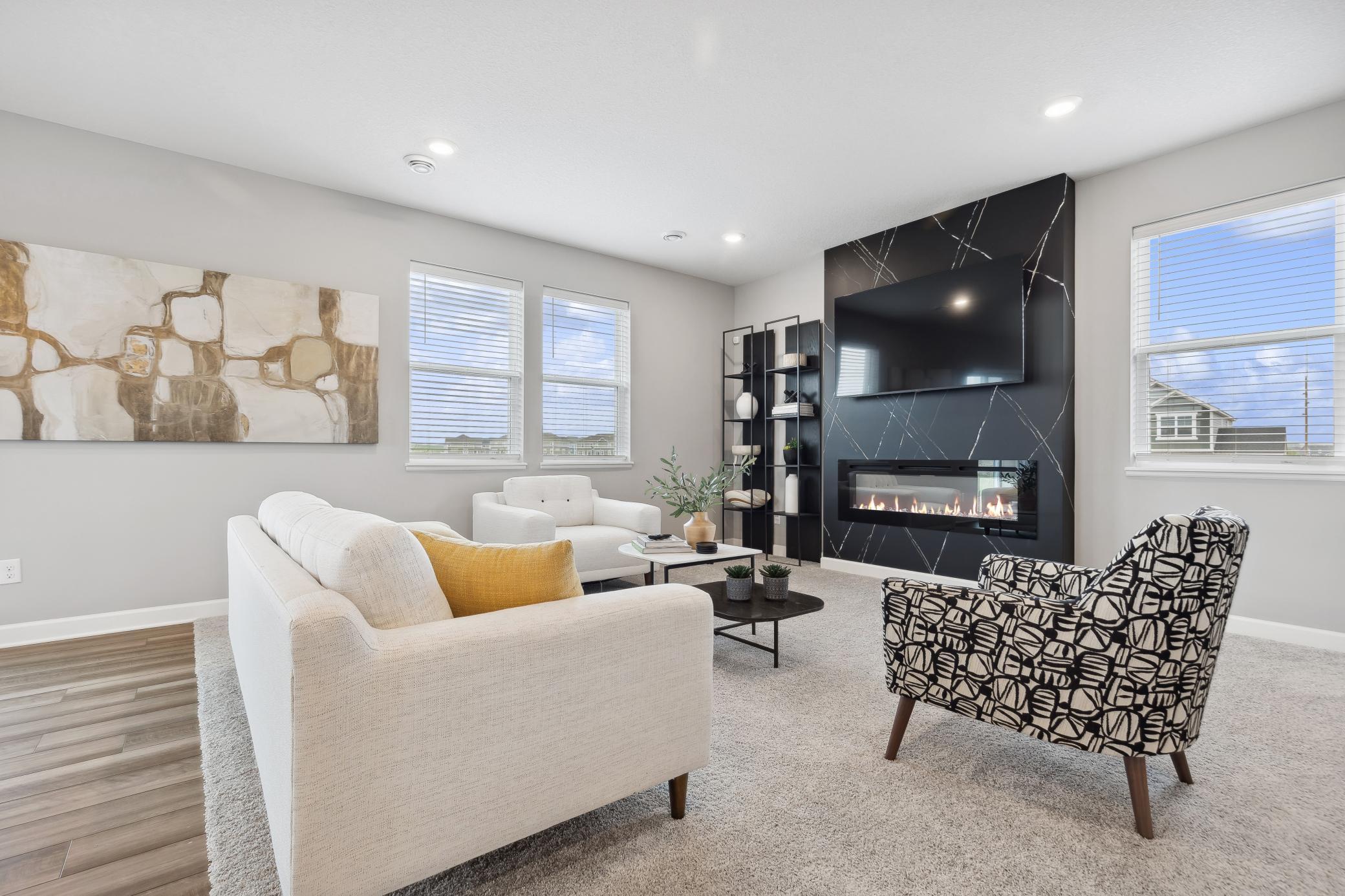 With a cozy fireplace and great natural lighting, the Great Room is a comfortable space to relax