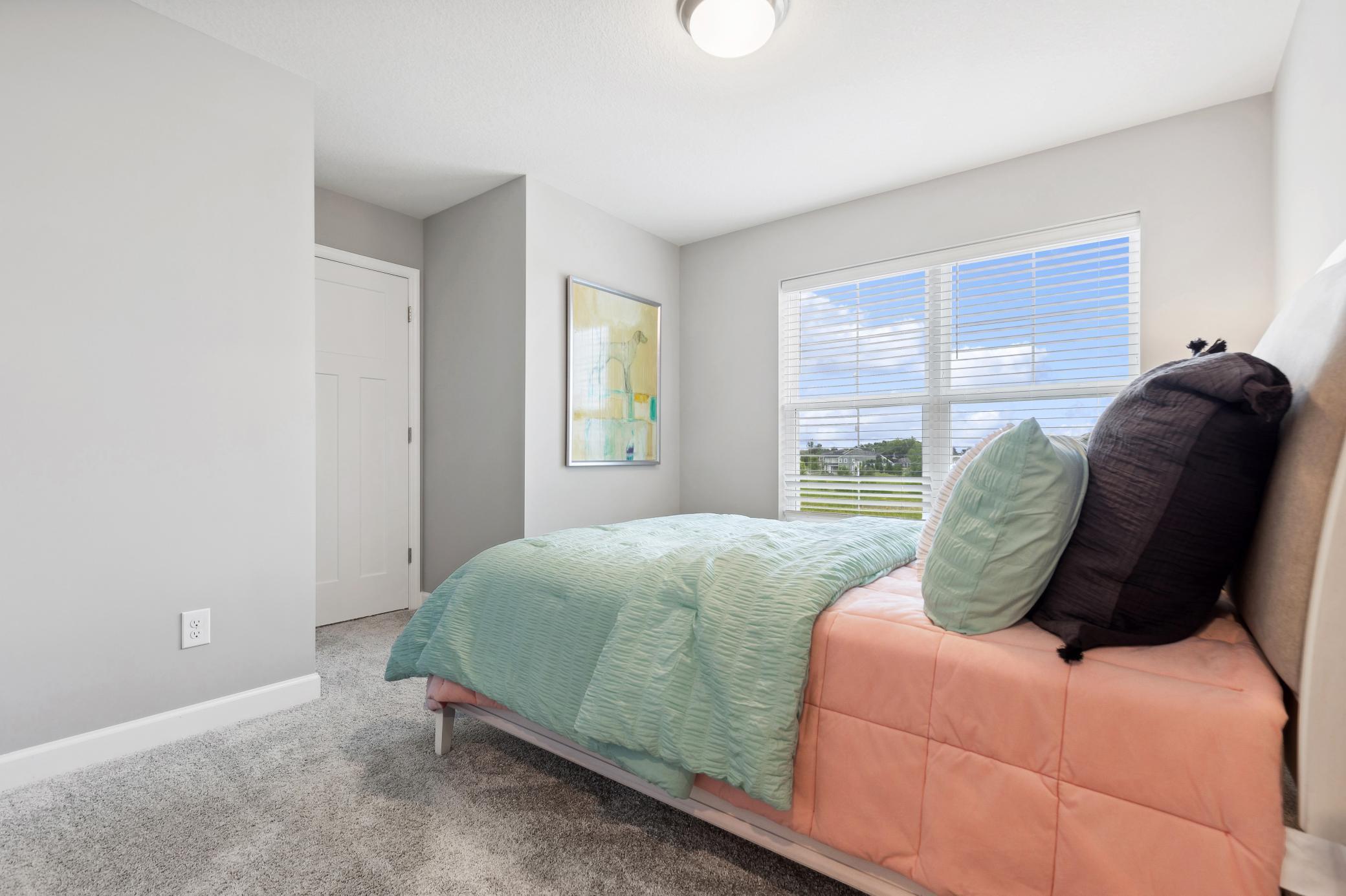 Any of the secondary bedrooms can be transformed to meet the household’s needs. This bedroom can be used as a nursery, as shown here.