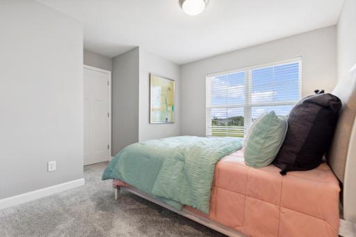 Any of the secondary bedrooms can be transformed to meet the household’s needs. This bedroom can be used as a nursery, as shown here.