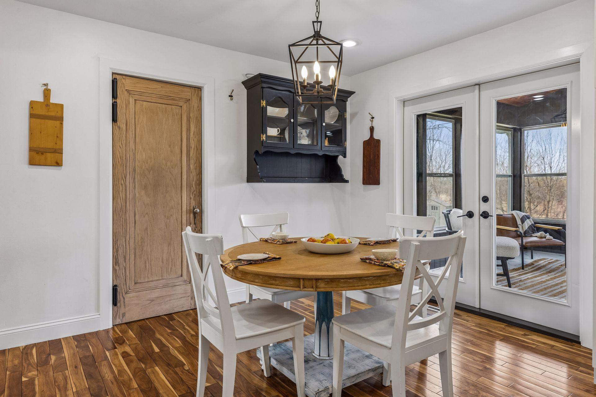 Informal dining flows to the porch and maintenance free deck.