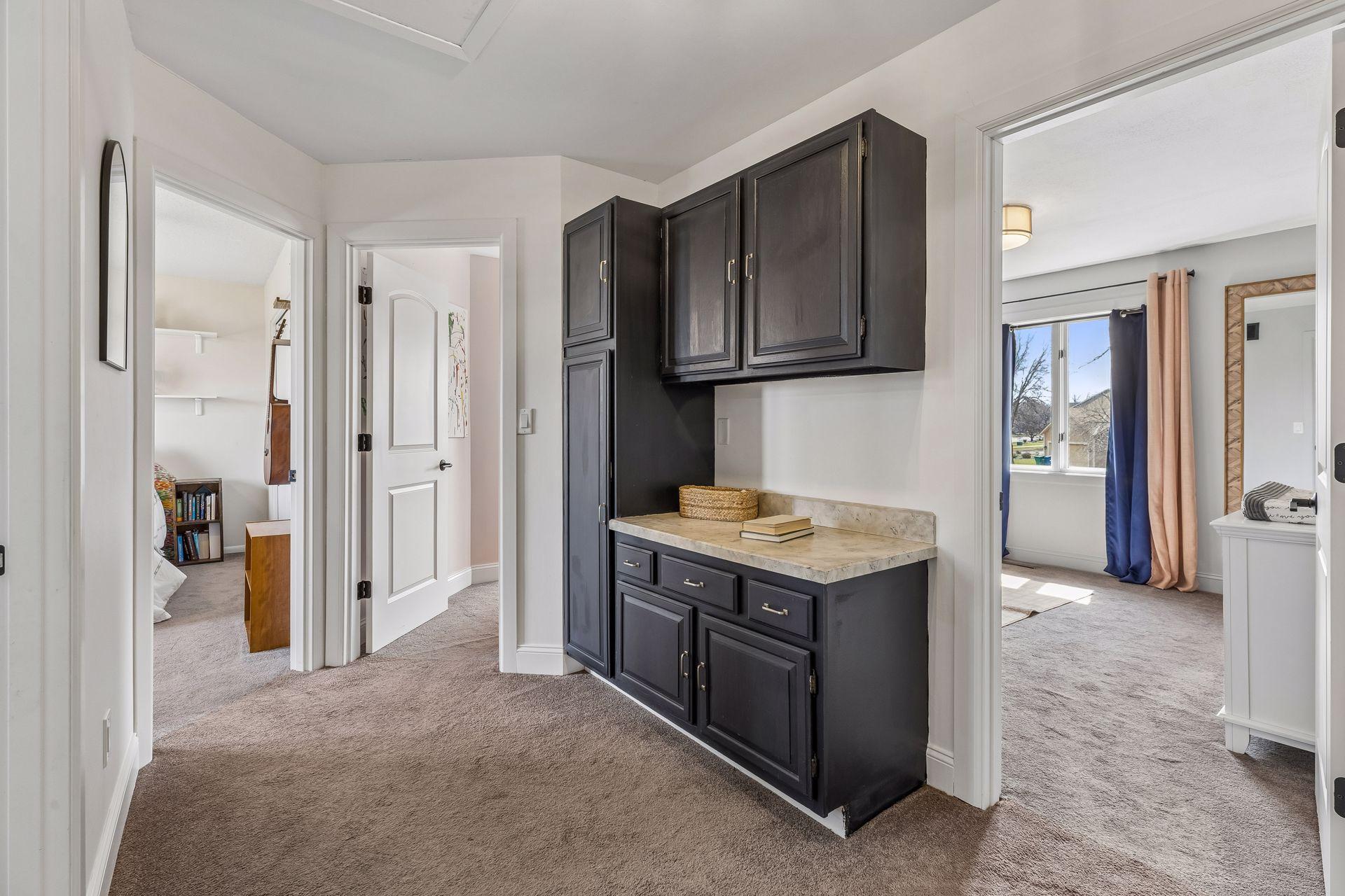 Upper level landing provides great storage space.