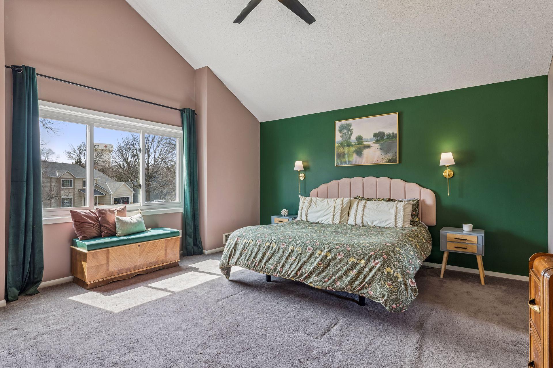 Expansive primary bedroom with more of that natural light.