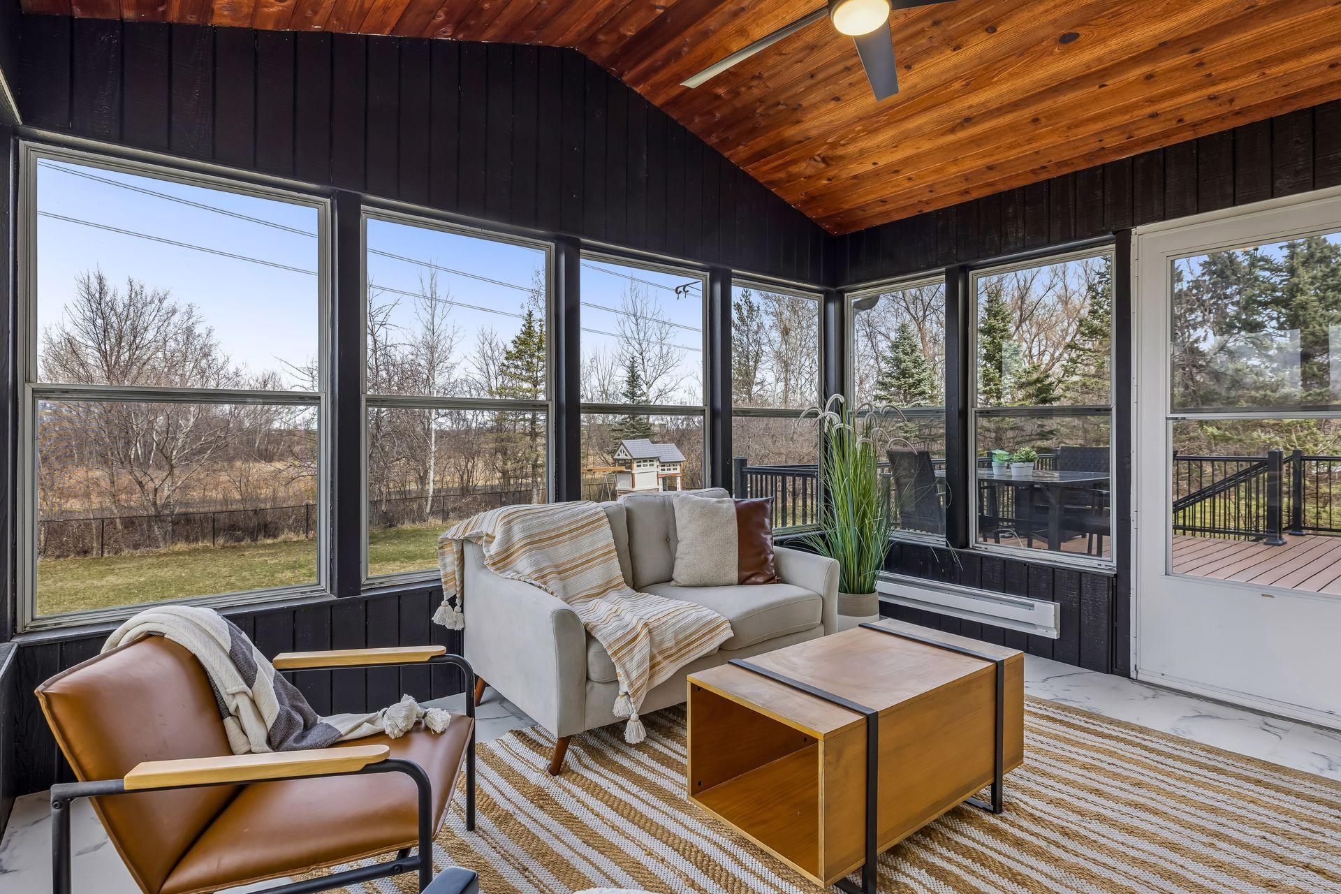 Porch overlooks the large private backyard with direct access to walking/biking trail.