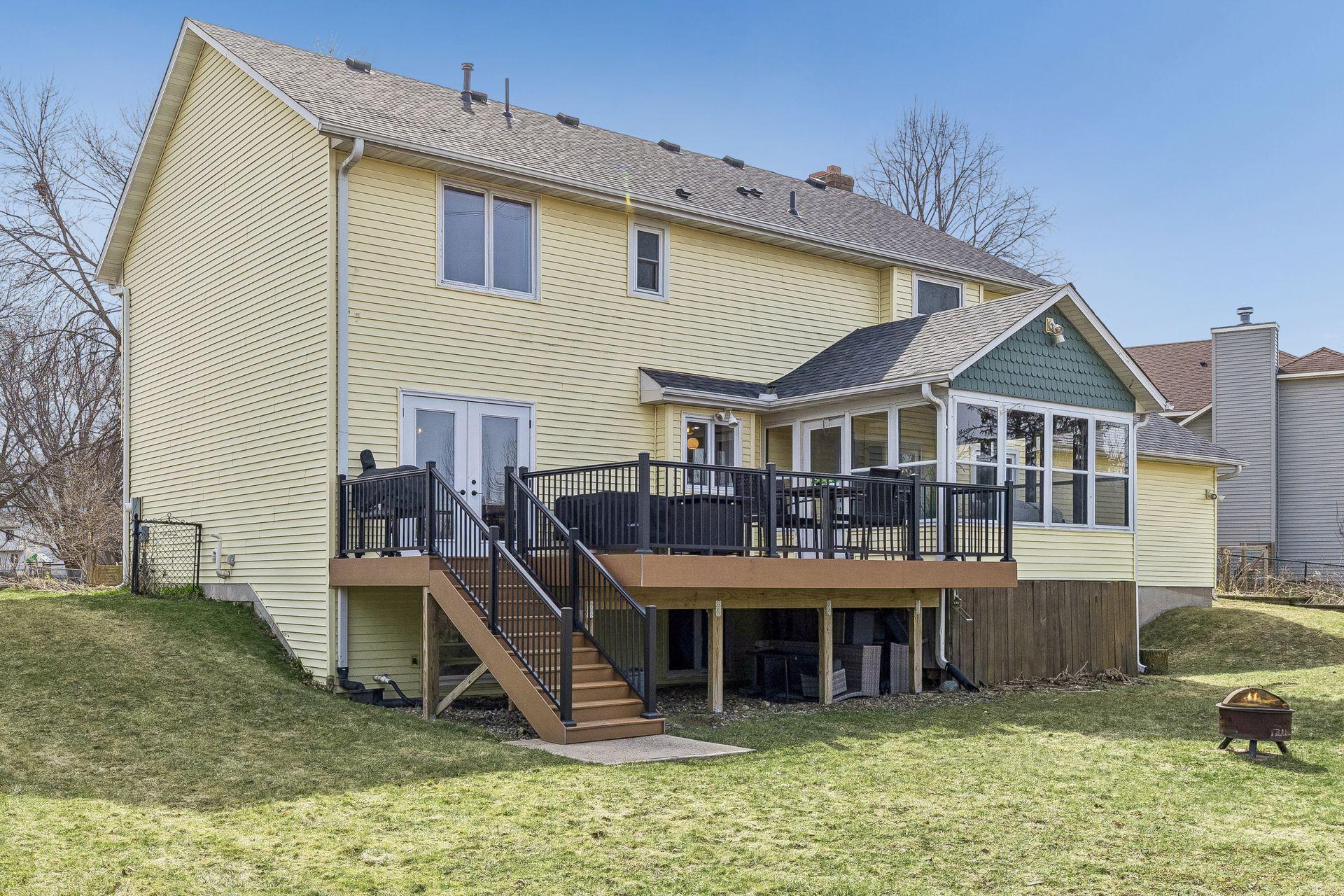 Expansive maintenance free deck leads to huge, flat, private back yard.