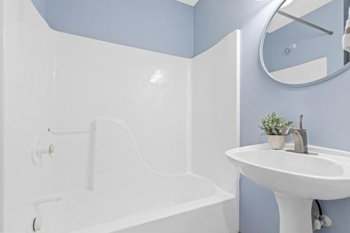 Main floor full bathroom is bright and light.