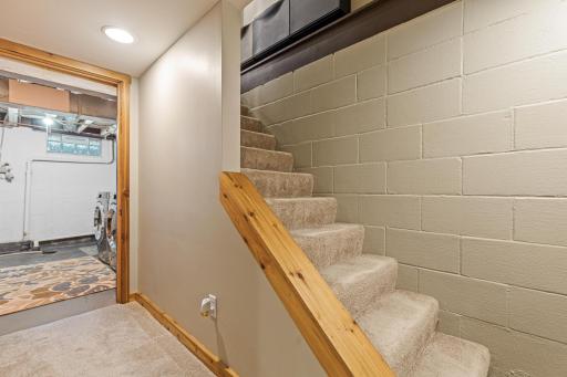 Stairs leading downstairs to the fourth bedroom, utility and laundry room.