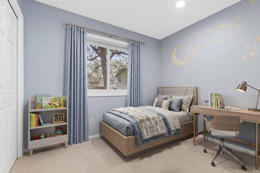 One of three bedrooms located on the upper level. This one overlooks the beautiful backyard. Visually staged.