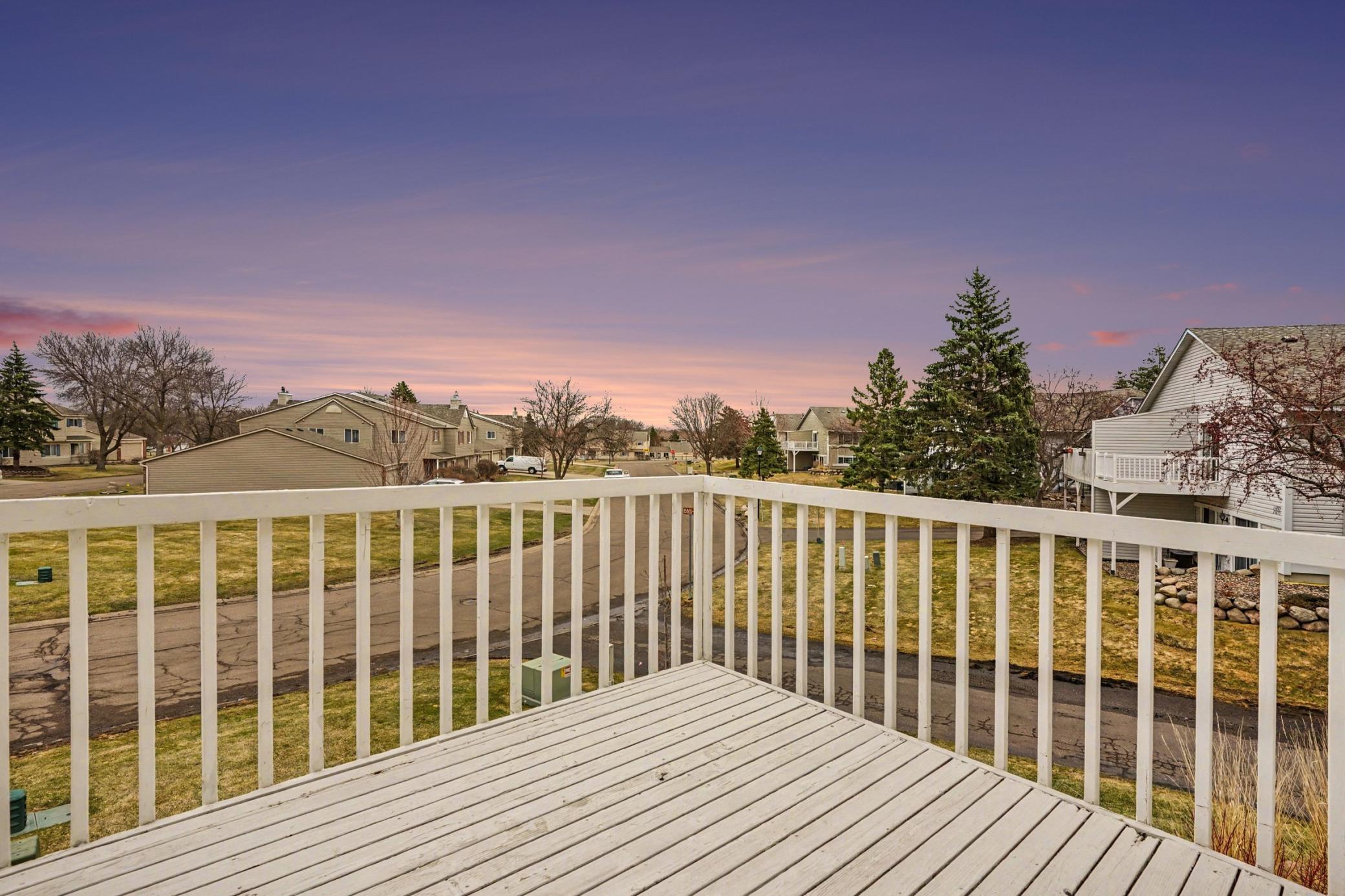 Private townhome deck with peaceful neighborhood views—perfect spot to unwind or enjoy your morning coffee.