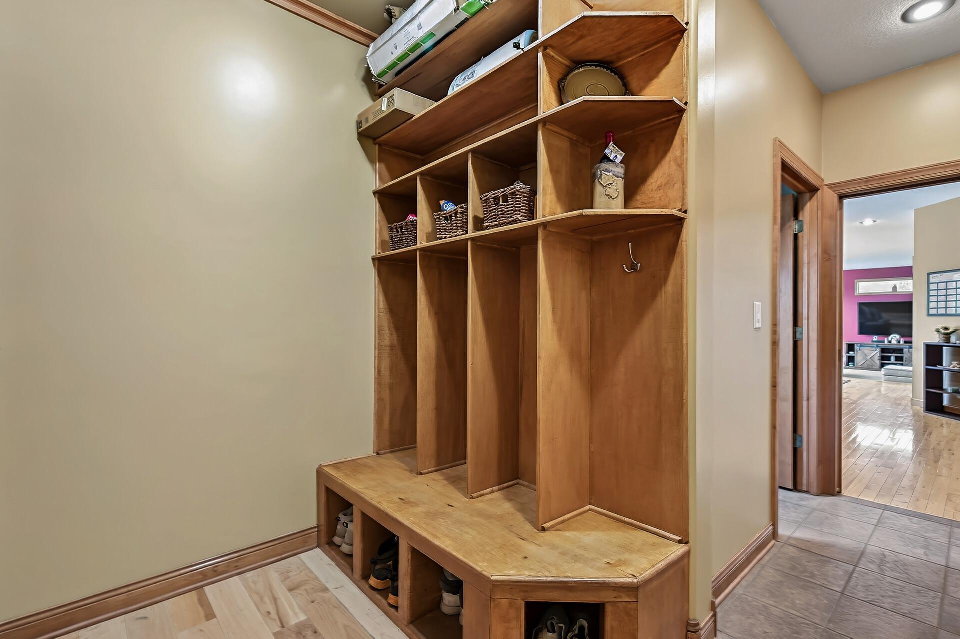 Nice built in storage as you come in from the garage area.