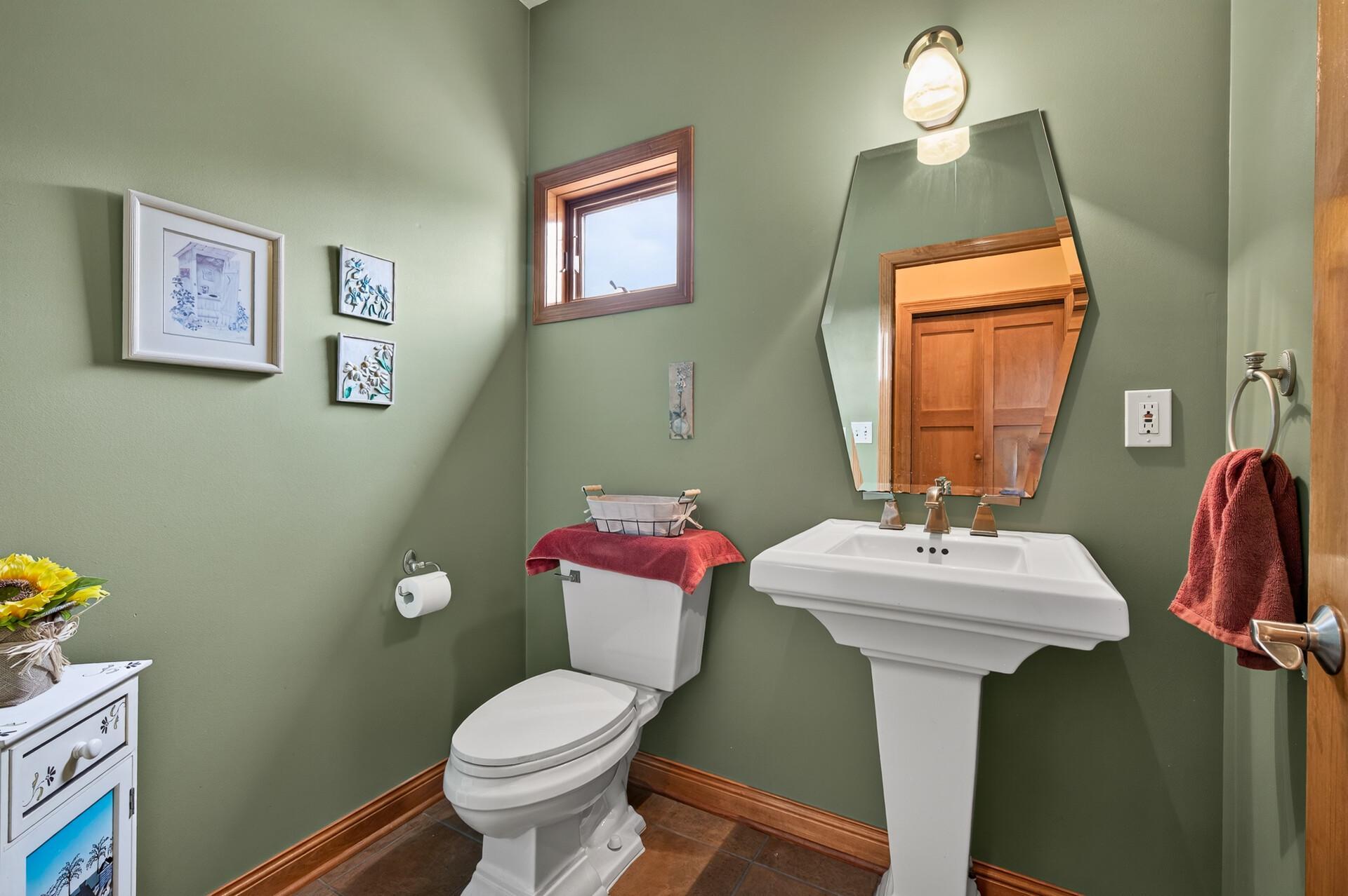 This is the only 1/2 bath in the home just steps away from the kitchen.
