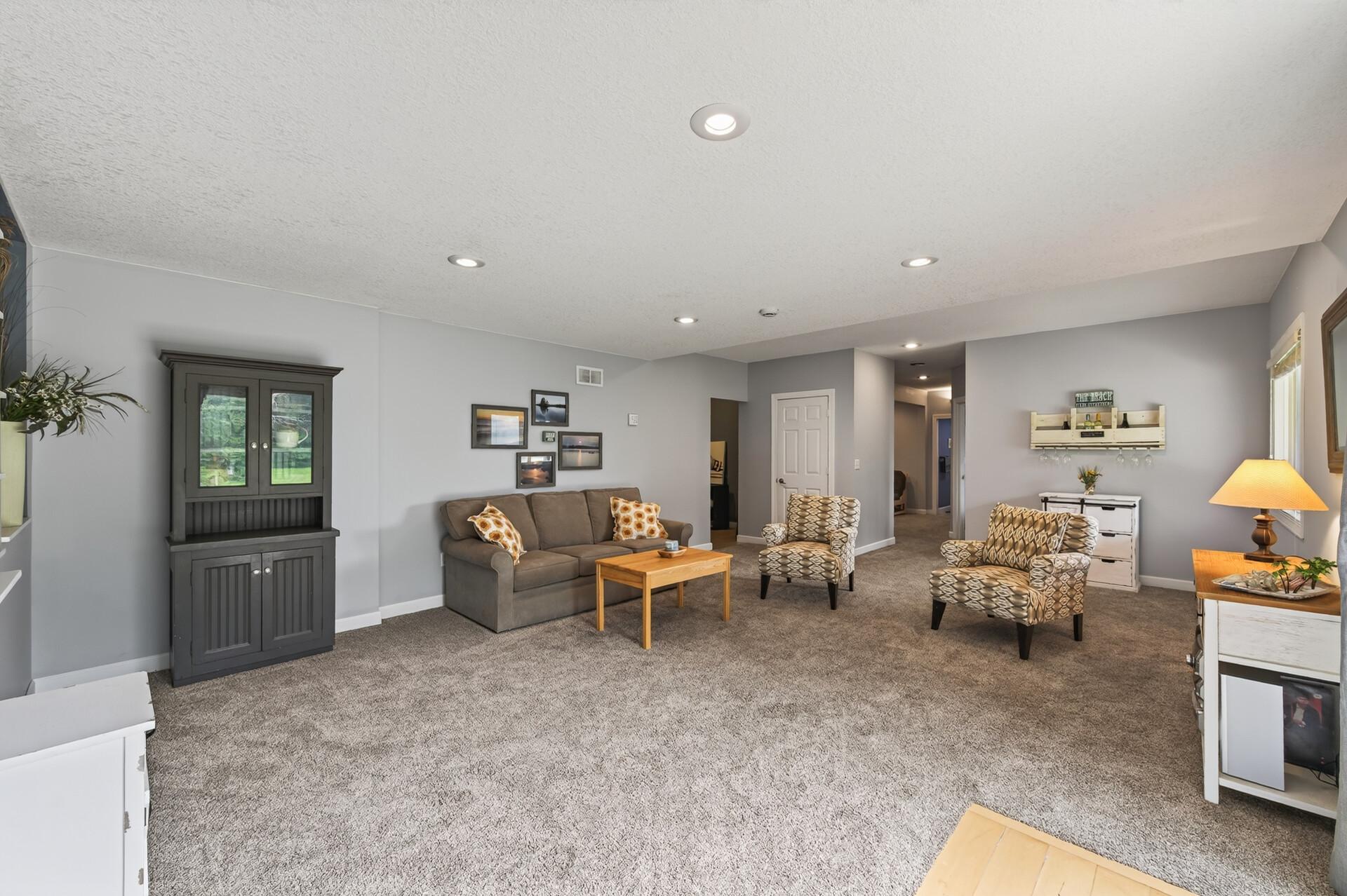 Another view of the lower level family room with plenty of natural lighting.