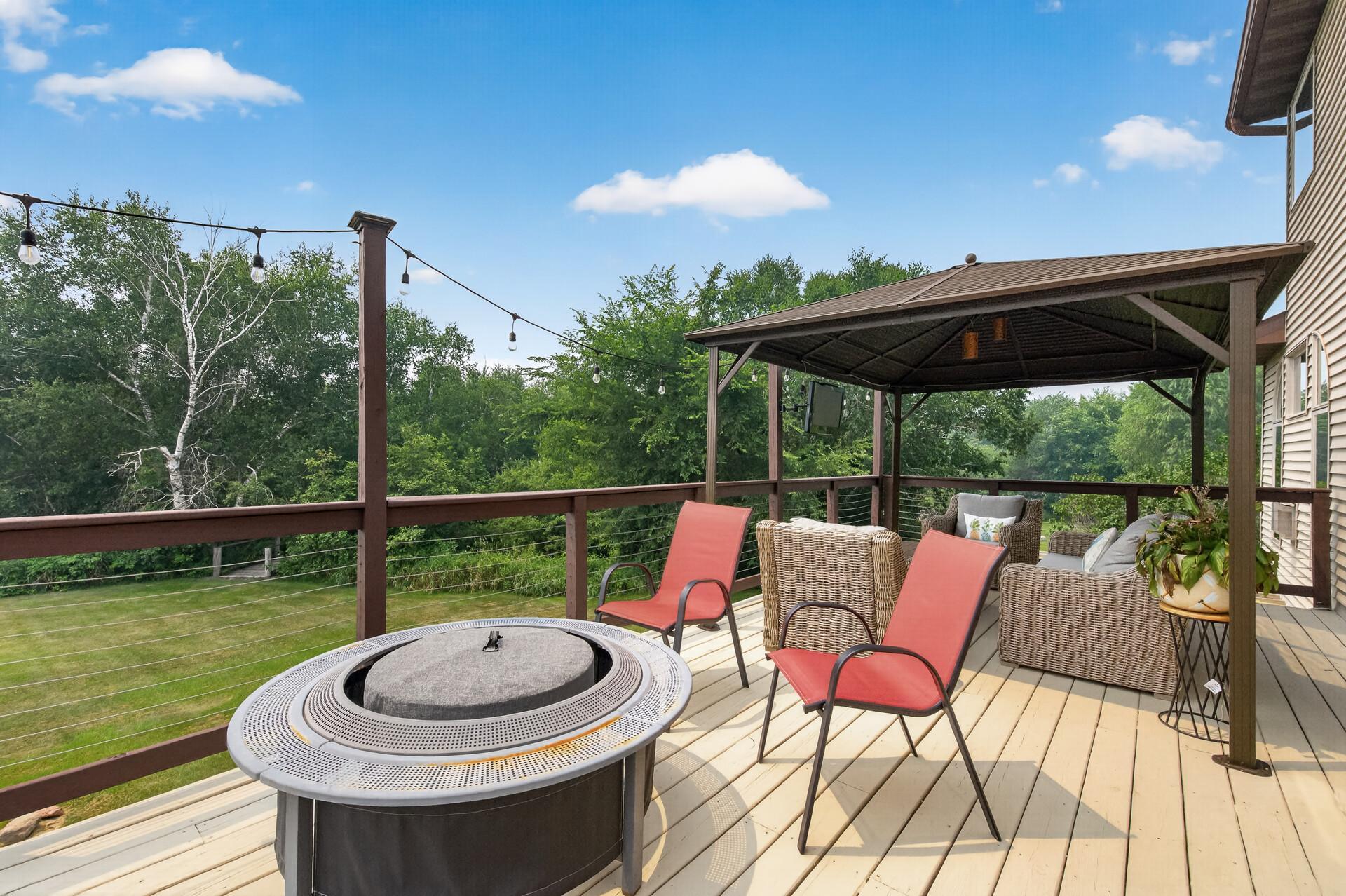 Back deck overlooking the Volleyball court and the Bridge and creek.