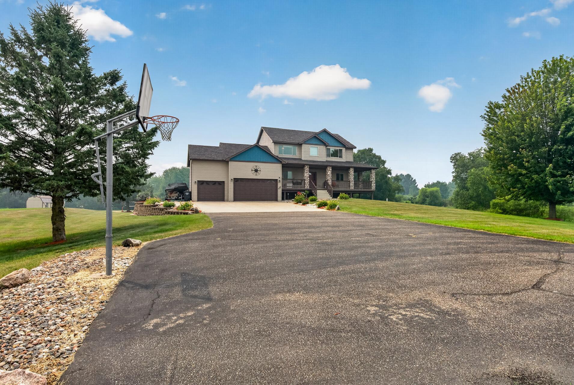 Concrete and asphalt driveway with plenty of side parking for the boat or RV