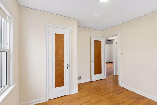 Main level bedroom, notice the classic hardwood doors.
