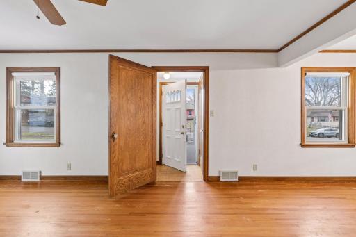 Quaint front entryway once you step inside. Storm door plus main door with doorglass.