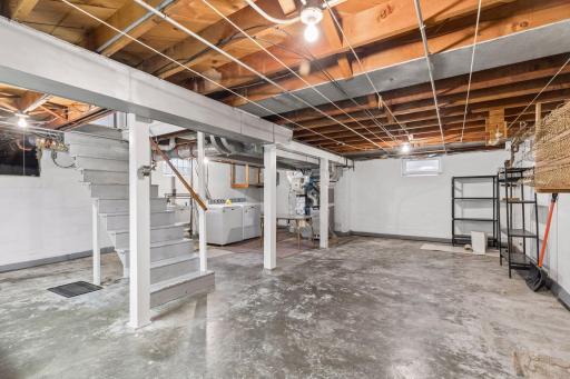 Unfinished lower level offers plenty of storage space or room to finish off.