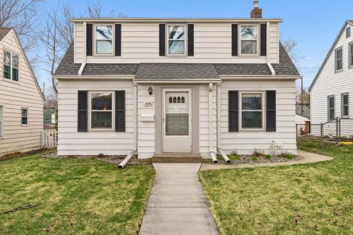 1935 Arlington Avenue East - Dressed in white maintenance-free siding and complementary black shutters.