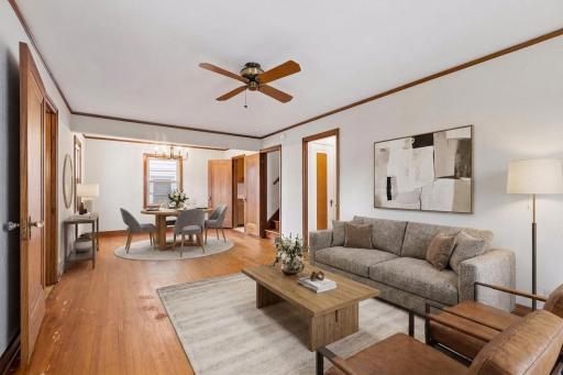 Hardwood flooring in main level living space, bedroom and stairs.