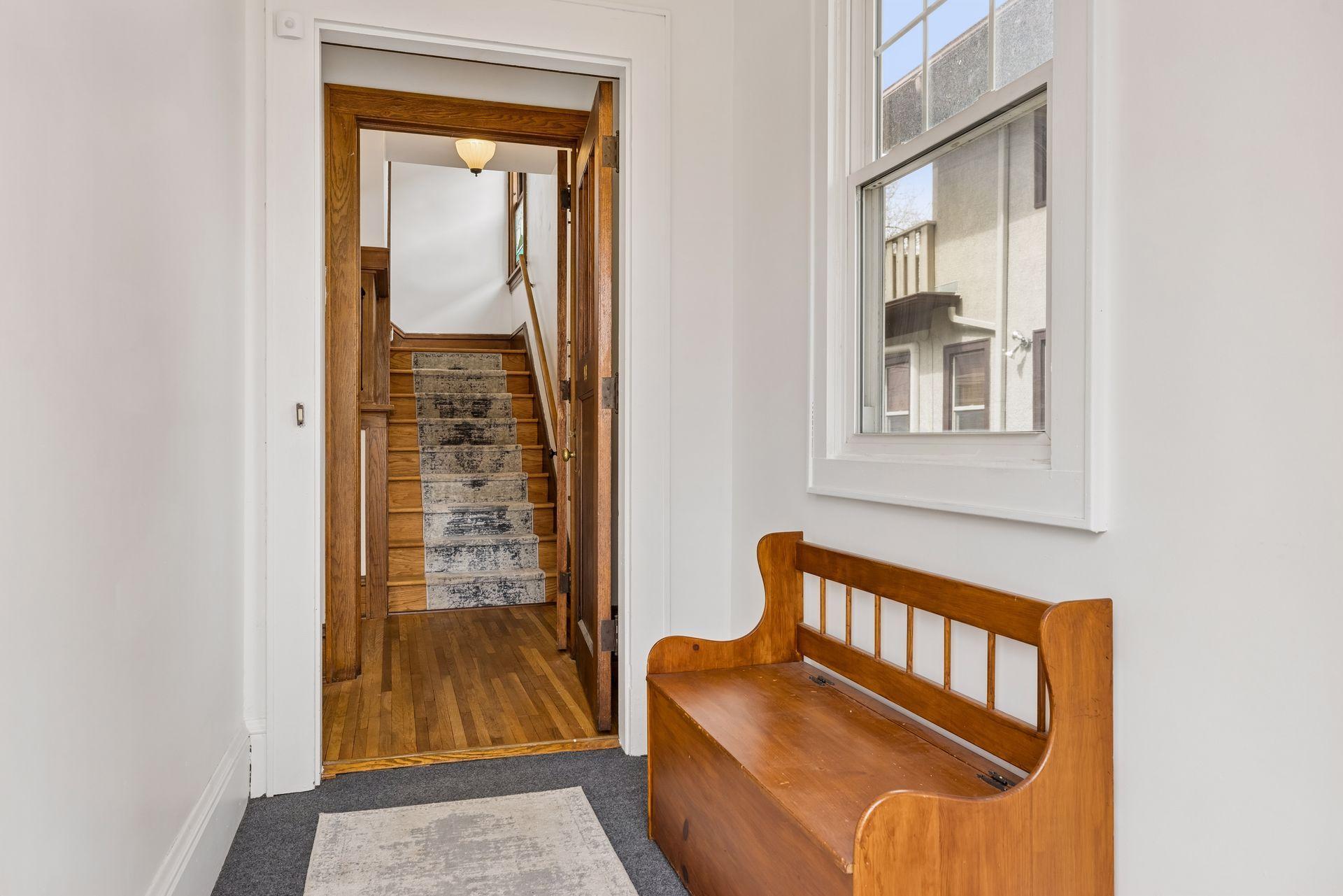 Step inside to a cozy enclosed front porch.