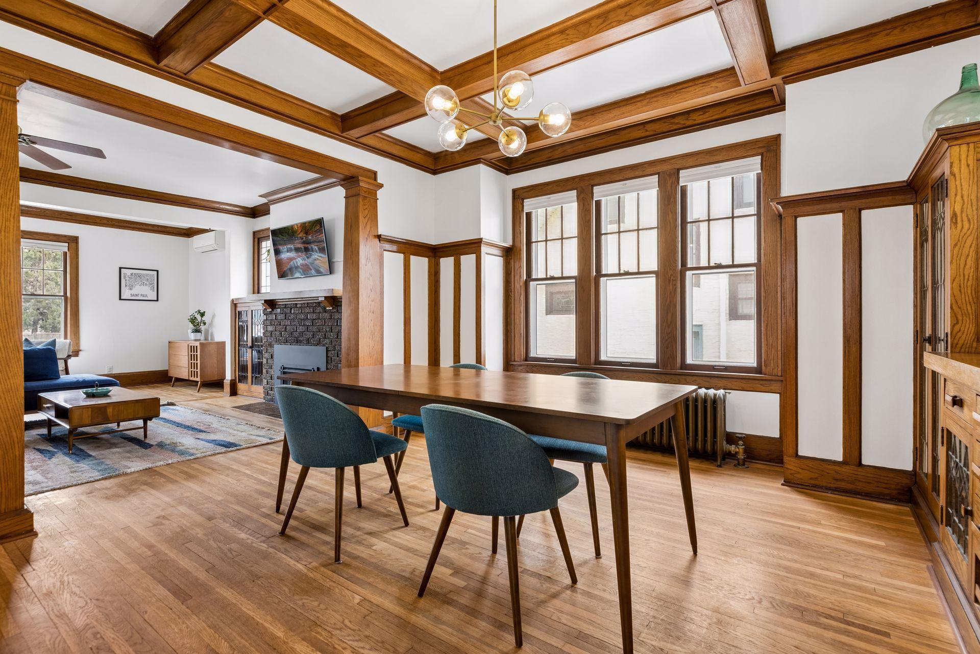 The dining and living room feature the original double hung sash windows, preserving the architectural integrity of the space. New storm windows were installed in 2020.