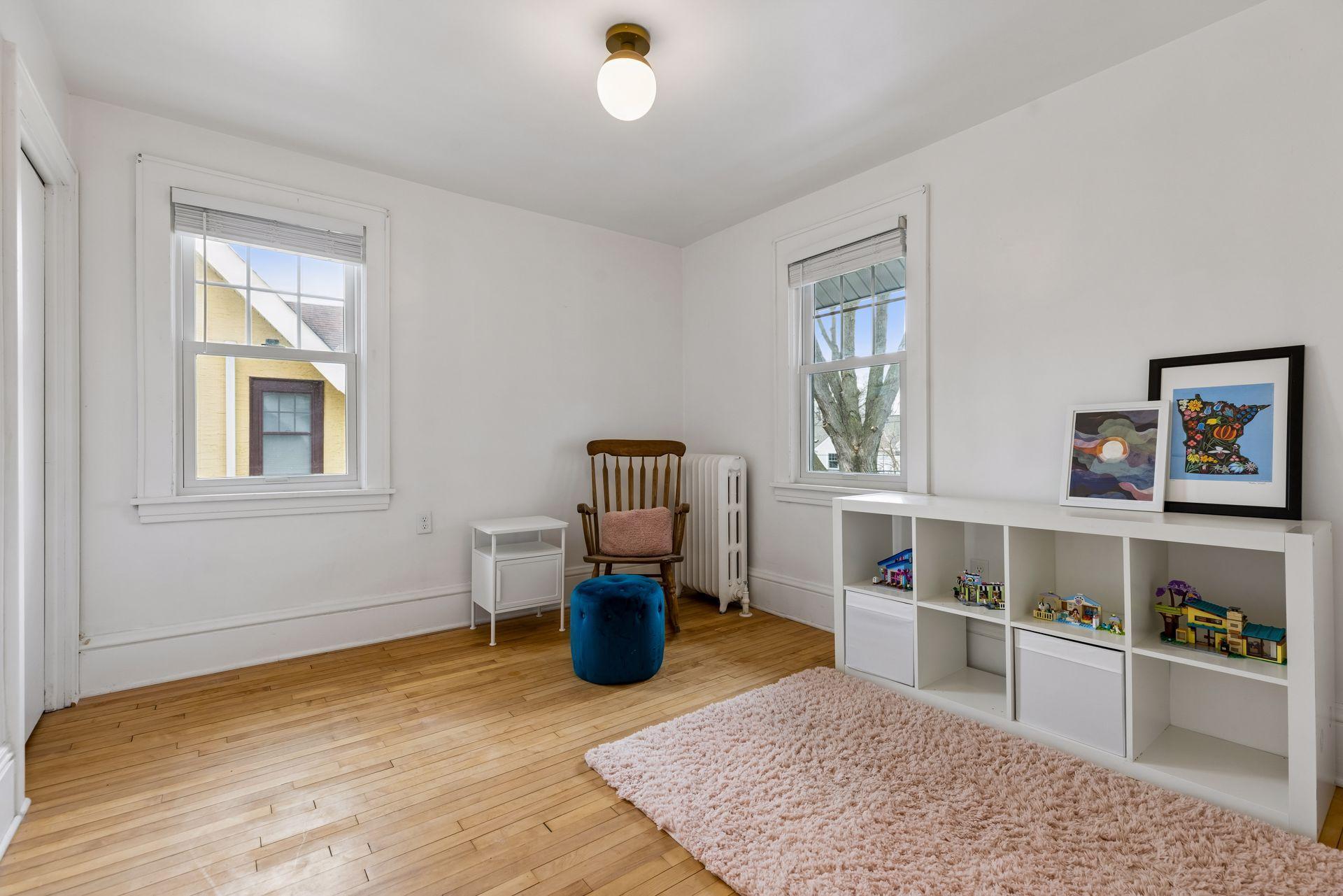 While being used as a playroom, this is one of the three bedrooms on the upper level.