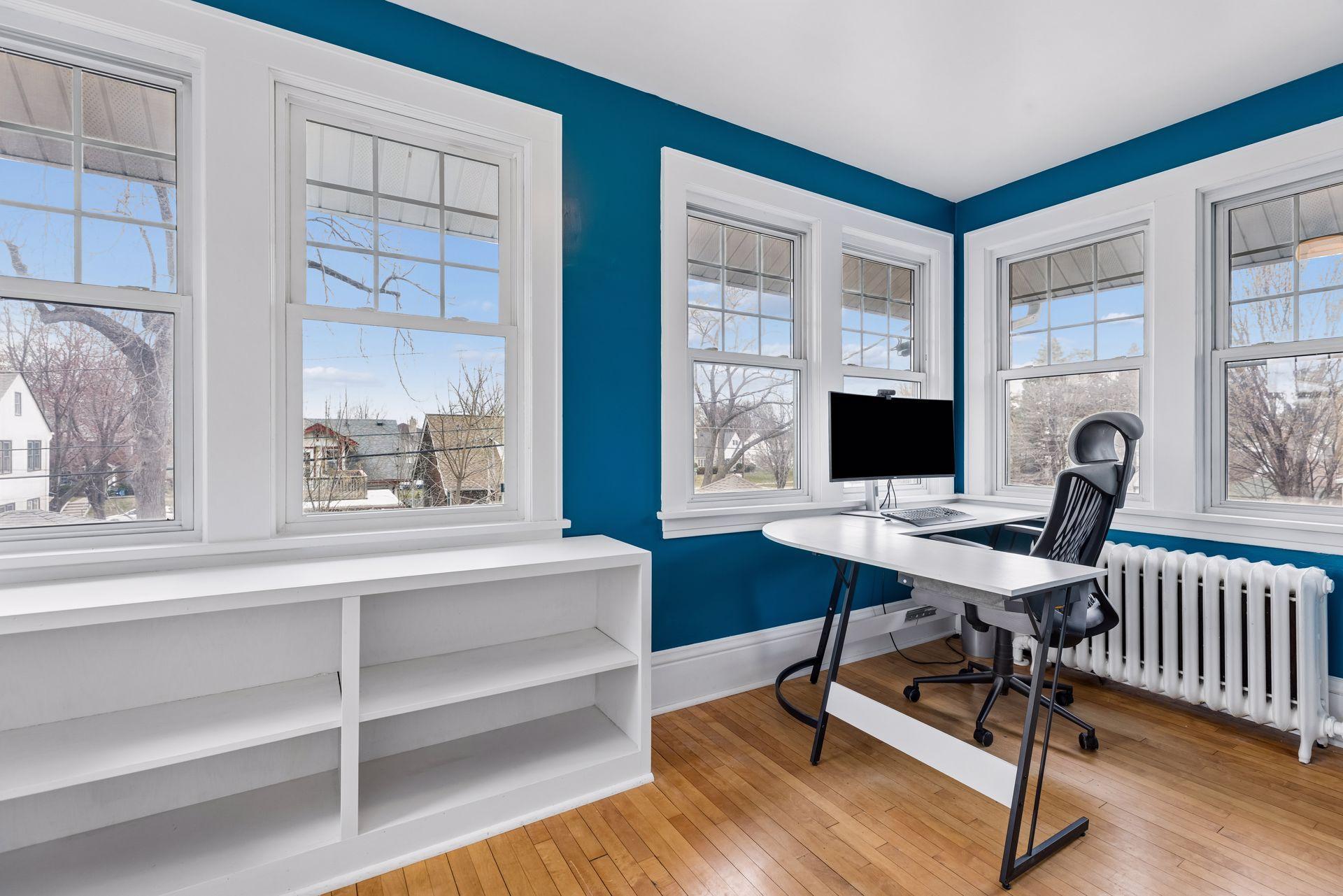 The fourth room upstairs is currently being used as an office, and has a full panoramic view of the yard.