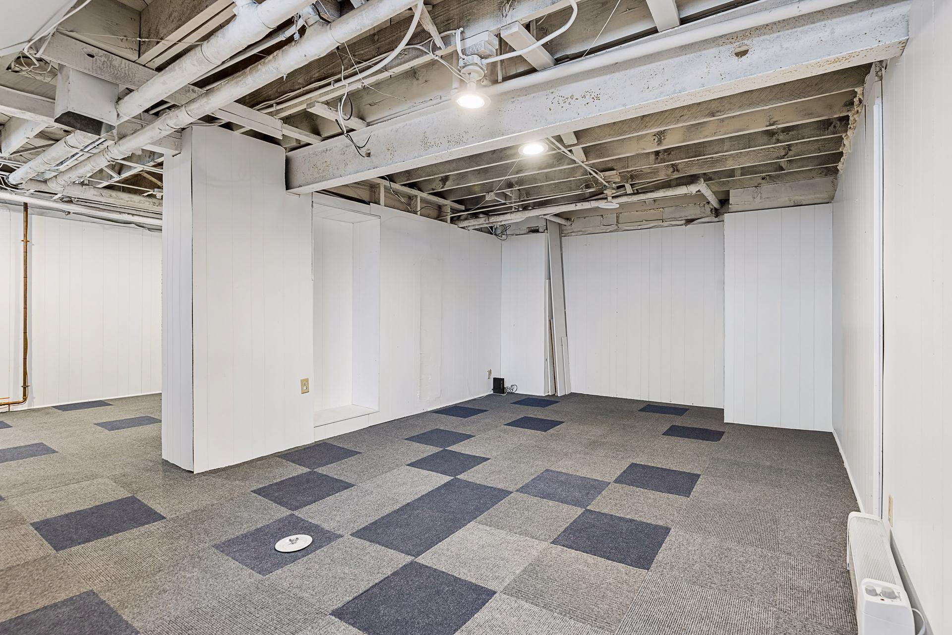 The basement was refreshed in 2021 with the addition of new paint and carpet tiles