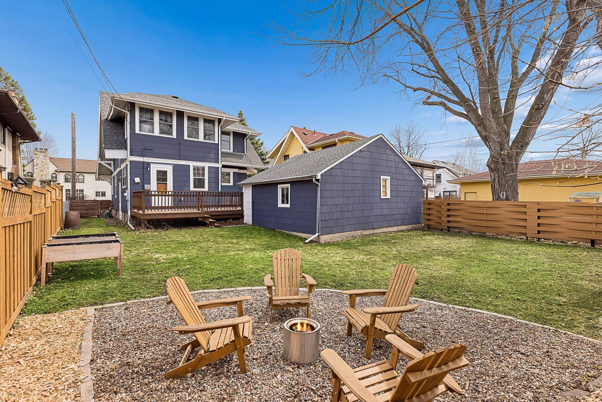 The lot is deep and private, and features a separate bonfire seating area towards the back.
