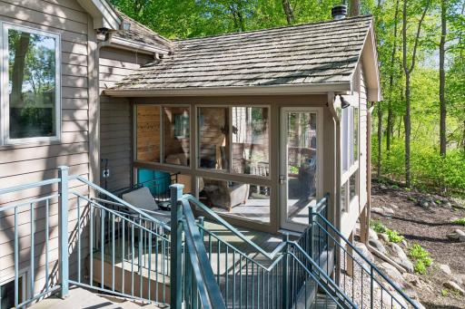 Step down to the three season porch from the deck