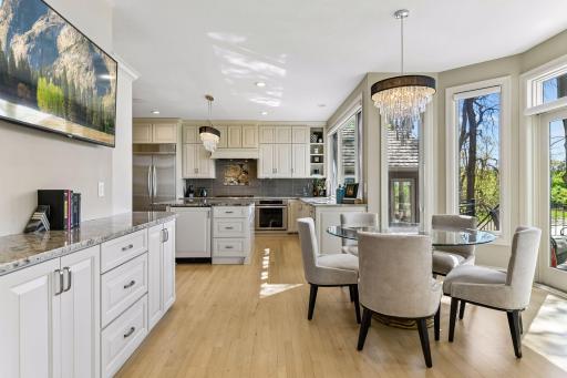 Informal dining room between the living room and kitchen and access to the deck