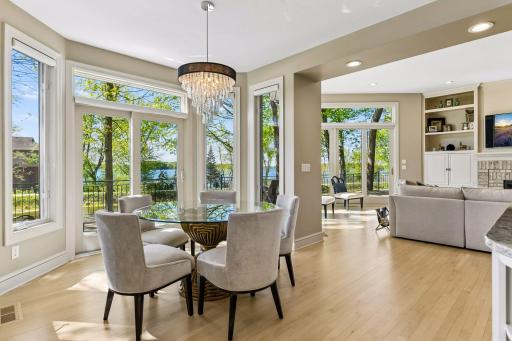 Informal dining room between the living room and kitchen with access to the deck