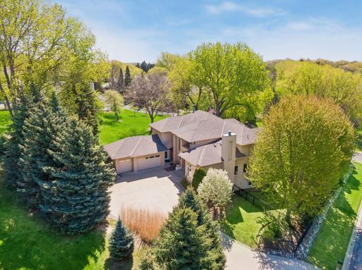 Imagine waking up to woodland views, trail access, and complete privacy just minutes from everything Eden Prairie has to offer.