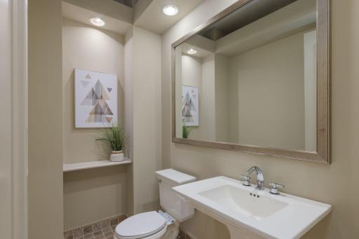 Clean lines, timeless finishes, and thoughtful design come together in this beautifully appointed powder room, perfectly positioned for guests and everyday convenience.