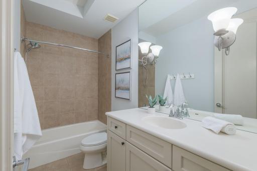 Well-appointed secondary bath with timeless finishes.