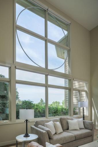 Walls of glass frame sweeping views and fill the home with natural light.