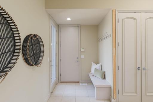 Thoughtfully designed for everyday living, the spacious mudroom offers convenient storage, built-in seating, and a welcoming transition from the outdoors.