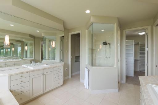 A spacious primary bath designed for comfort and convenience.