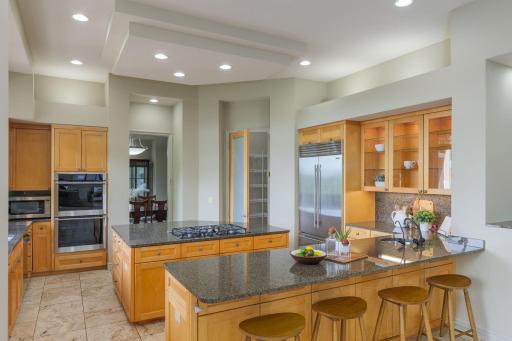 Thoughtfully designed for both everyday living and entertaining, this chef-inspired kitchen offers generous workspaces, premium appliances, and exceptional storage.