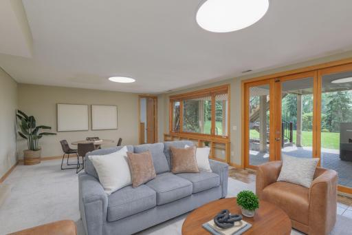 Flexible lower-level living space for entertaining, relaxing, or hosting guests.