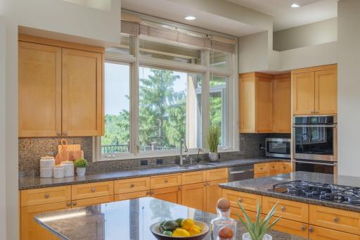 Custom cabinetry, abundant storage, and timeless finishes elevate everyday living.