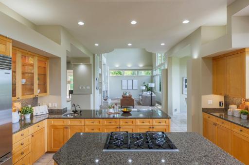 From the kitchen, open views extend into the great room, creating effortless flow and a sense of connection throughout the main level.