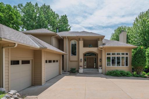Exceptional curb appeal paired with an inviting front courtyard.