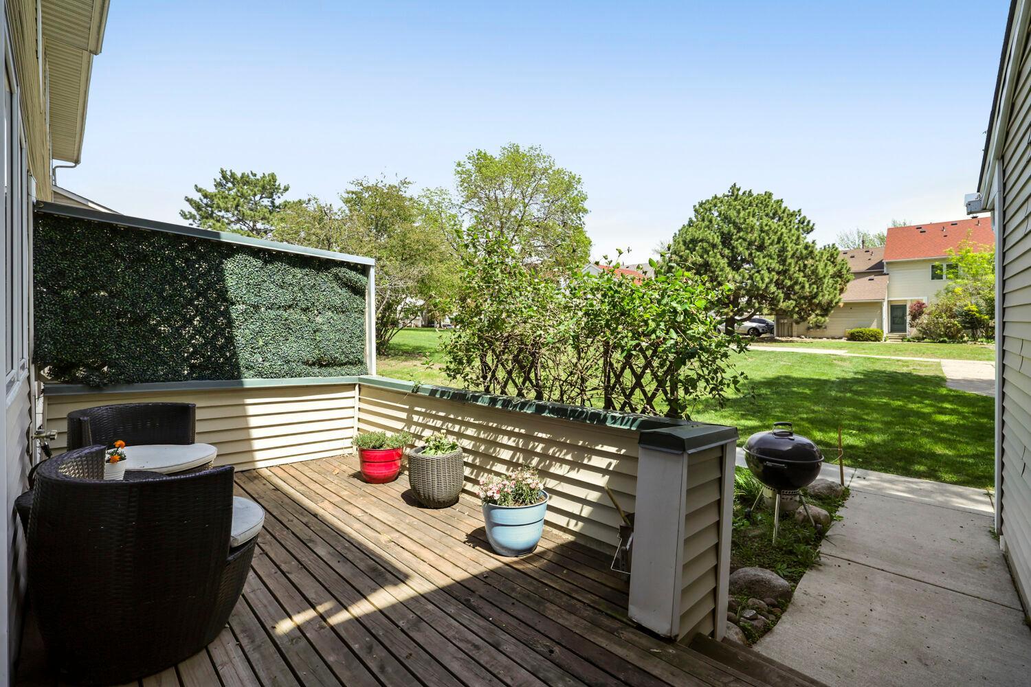 Relaxing back deck faces the large common grassy lawn
