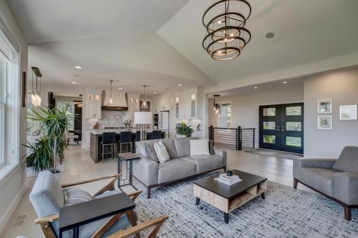 Every detail has been thoughtfully curated, blending timeless elegance with modern sophistication to create a home that is as impressive as it is inviting. A sleek architectural railing connects both levels with modern style.