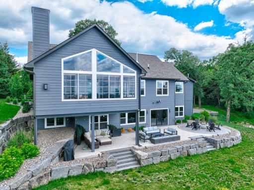 Step outside to nearly 1,000 square feet of beautifully designed patio space featuring multiple natural gas fire features, stunning landscaping, and abundant room to relax, entertain, and take in the surrounding natural beauty.