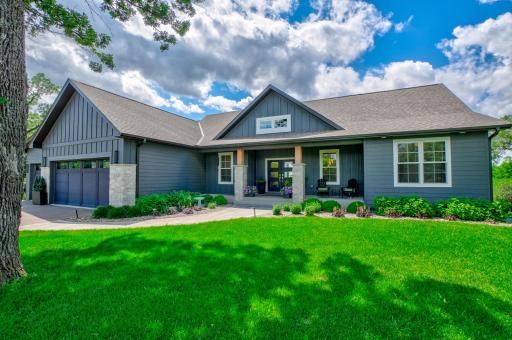 Completing the property is a heated oversized 4-car garage and a substantial tuck-under garage offering incredible storage, workshop space, and room for additional vehicles and recreational equipment.