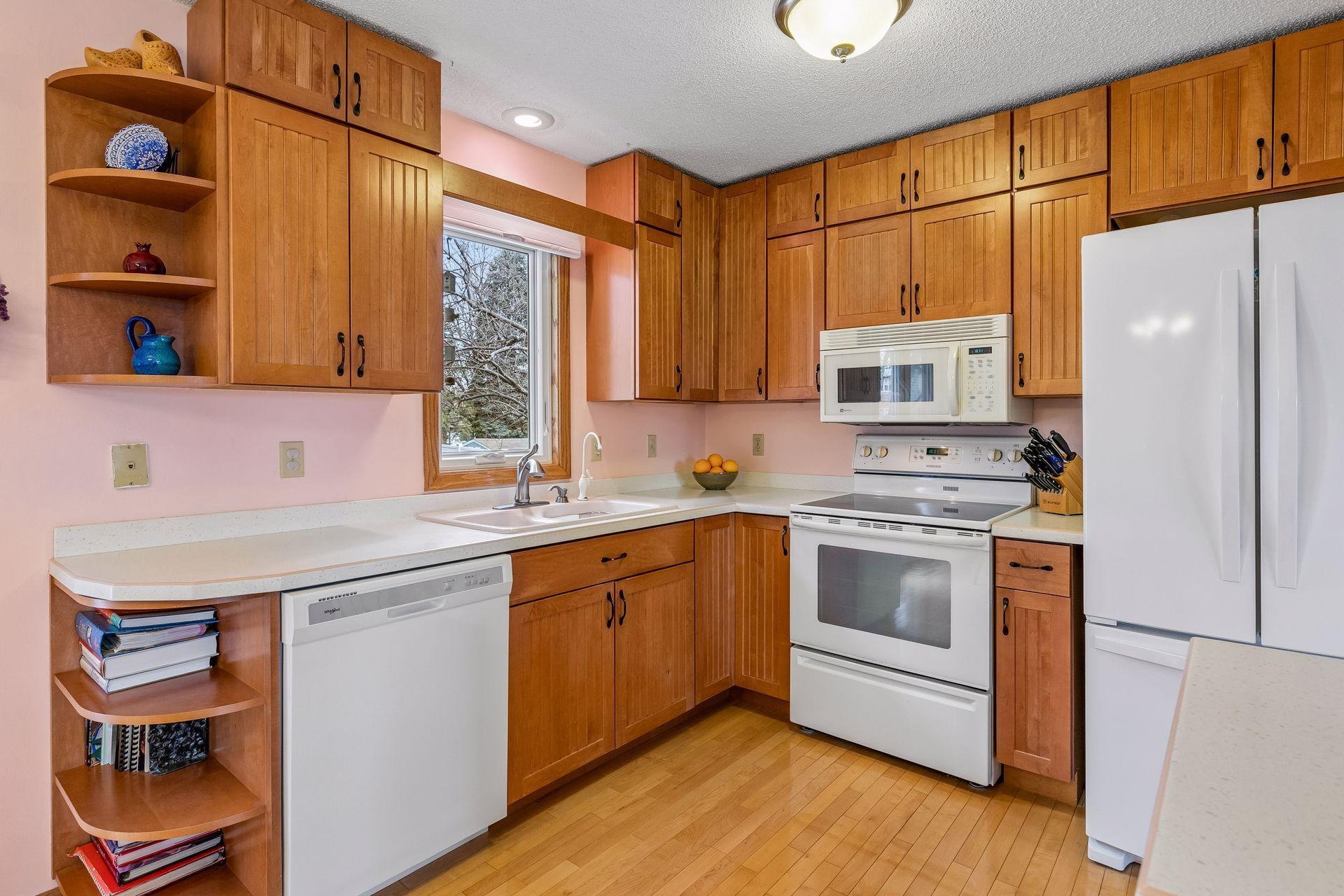 Abundant cabinet space + a kitchen window you'll appreciate!