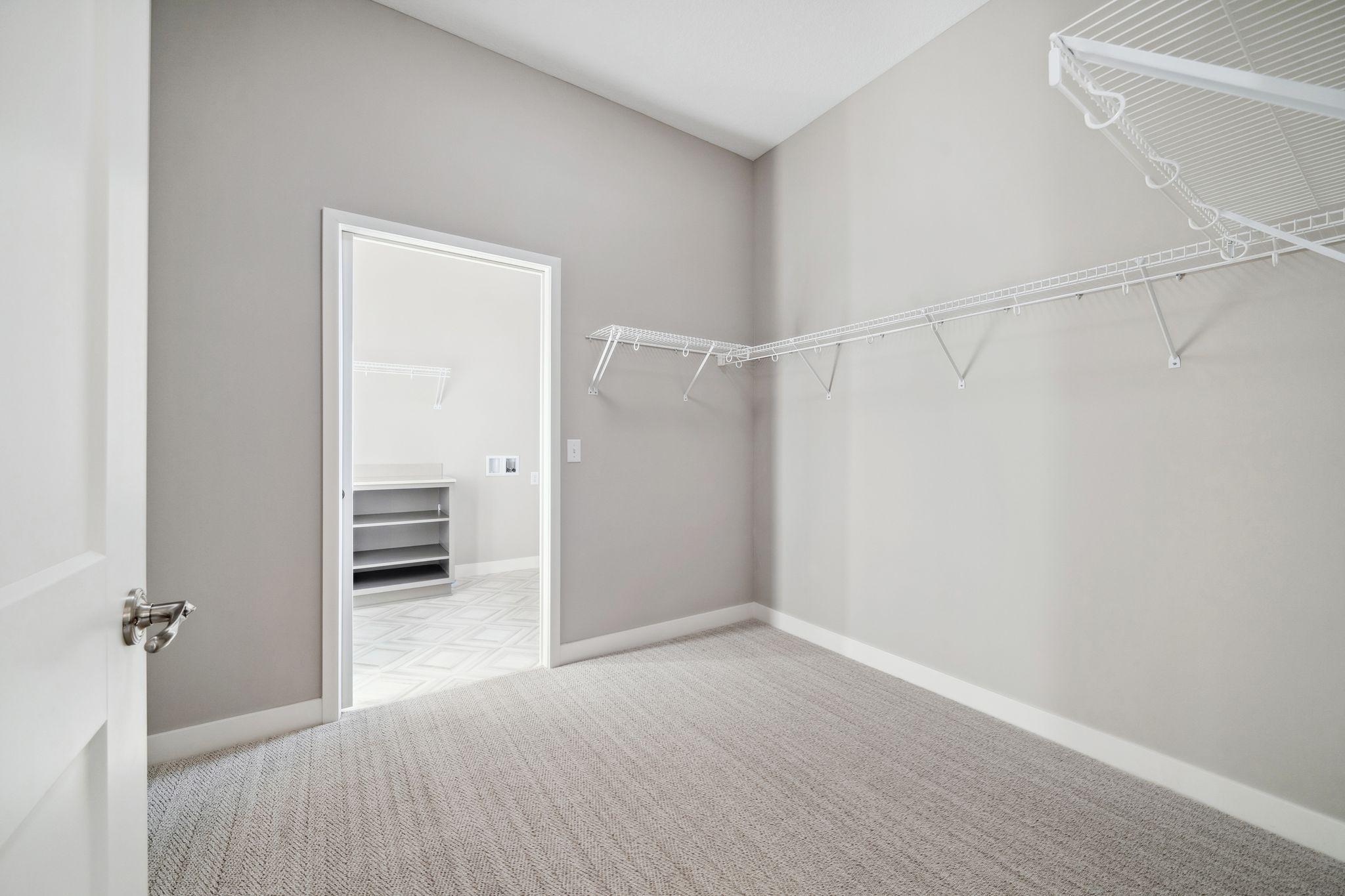 Large walk-in closet that leads to bathroom and laundry room.
